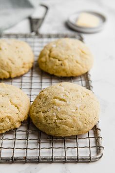 four cookies cooling on a wire rack