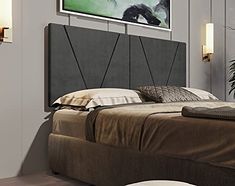 a bedroom with a bed, nightstands and pictures on the wall above it's headboard