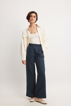 These pants feature a high waist with a zipper and button closure and belt loops. They have two side slanting pockets at the front and two back mock pockets. The pants have wide legs. Inseam length in size 36: 79 cm / 31.1 in. Linen Wide Leg Pants, Wide Leg Linen Pants, Jeans Rock, Professional Outfits, Wide Legs, Leg Pants, Wide Leg Pants, Jumper, High Waist