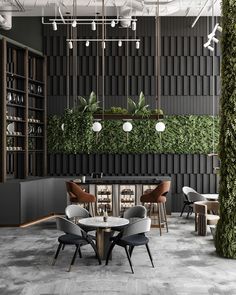 the interior of a restaurant with plants growing on the wall and tables in the center