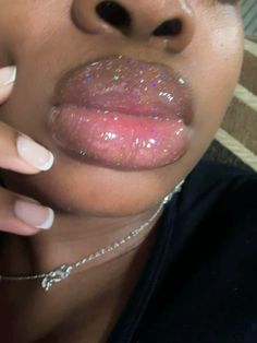 a close up of a person with glitter on her lips