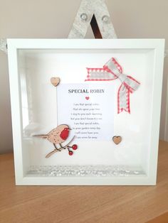 a white frame with a red bird on it and a poem in the middle that says special form