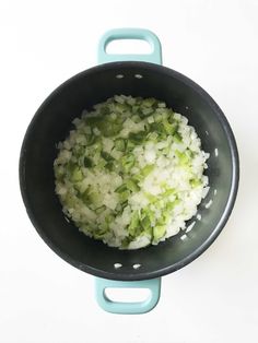 onions and celery are being cooked in a pan