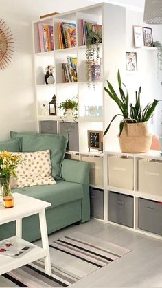 a living room filled with furniture and lots of bookshelves on top of it