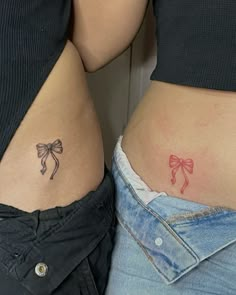 two women's butts with bows on their side, one has a small bow