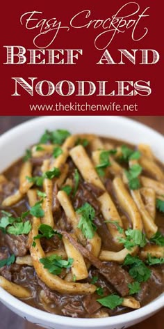 beef and noodle soup in a white bowl with parsley garnish on top