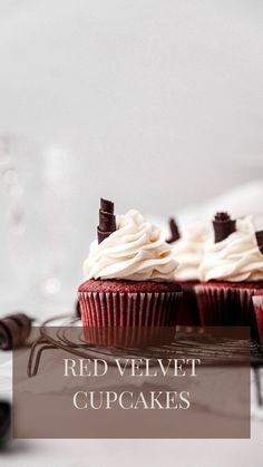 red velvet cupcakes with white frosting and chocolate sprinkles on top