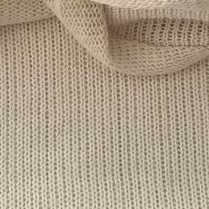 close up view of white knitted fabric