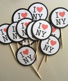 i love new york cupcake toppers on sticks with heart stickers in the middle