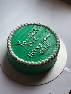 a green cake that is on top of a table