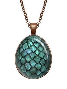 PRICES MAY VARY. Dragon Egg Pendant Necklace More dragon egg colors avaliable in my shop Metal color options: Silver, Gunmetal, Bronze, Copper This Dragon Egg Necklace is available in pendant necklace metal colors, silver, gunmetal black, copper or bronze. You can choose your metal color at the top of the listing. Glass pendant with a high quality image underneath the glass that gives the image a great shine and magnification which really enhances the look of the pendant. Dimensions: 1in x 1.25i Turquoise Dragon, Egg Colors, Game Thrones, Egg Necklace, Game Of Thrones Dragons, Dragon Egg, Egg Shape, Metal Necklaces, Glass Jewelry