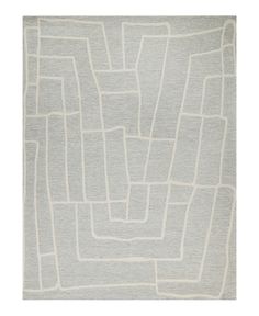 a gray rug with white squares and lines on the bottom, in front of a white background