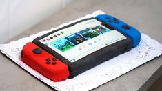 a cake made to look like a nintendo wii game console on top of a doily