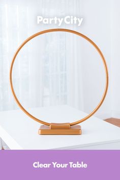 a round mirror on top of a table with the text party city clear your table