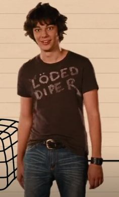 a young man standing in front of a jail cell with the words loaded diper on it