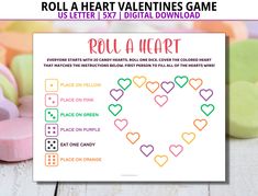 valentine's day roll a heart game is shown with candy hearts and candies