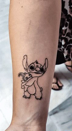 a small tattoo on the leg of a woman