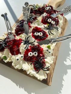 a cake decorated with white frosting and spider decorations