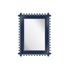 a mirror that is sitting on top of a white wall next to a black frame