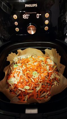 shredded carrots and other vegetables in an air fryer