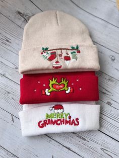 three christmas beanies sitting on top of each other