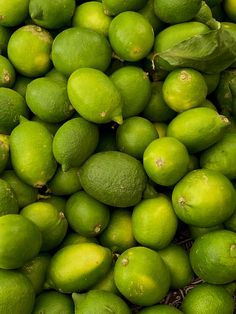 a pile of limes sitting next to each other