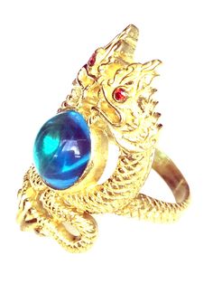 This is a very rare and perfect and unique magic ring made of blue ocean naga eye stone and silver gold plated, the power of the ring is to bring good luck and charm to the wearer. The ring showcases an elegant design with unique amulet style ring. It is great to get this ring for your loved one or treat yourself for a classic timeless style.  Ring US Size: 8,  Metal Type: silver gold plated,  Weight: 16.64 Gram (Approx.) The Belief about Blue Ocean Stone; 1. It's a very rare color. 2. It is the color of kings, powers, leaders, noble rulers. 3. People with high prestige will possess this color. 4. The possessor will have both prestige and power. 5. The possessor will be revered by the common people. 6. The owner will be born with enormous treasures. 7. It makes it agile in all aspects of w Stone Magic, Timeless Classic Style, Magic Ring, Ring Blue, Eye Stone, Blue Band, Blue Gemstones, Blue Rings, Color 2