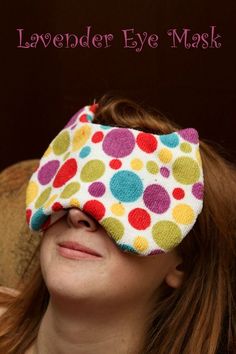 a woman wearing a colorful eye mask with polka dot fabric on it and the words lavender eye mask above her eyes