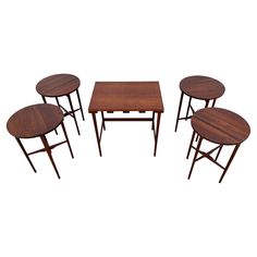 four tables and two stools are shown in this image