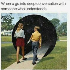 a man and woman walking down a sidewalk in front of a giant black object that says, when u go into deep conversation with someone who understands