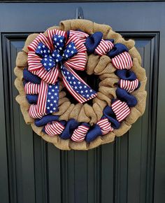 a patriotic wreath with red, white and blue bows