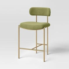 a chair with a green upholstered seat and gold frame, on a white background