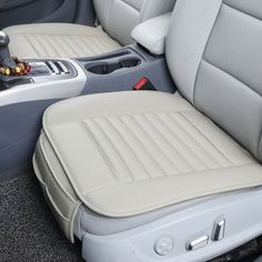 the interior of a car with beige leather seats