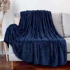 Premium Flannel Fleece Waffle Textured Throw Blanket by Pavilia This waffle throw blanket has a unique texture and is lightweight, warm, and cozy, making it the ideal choice for all season use. It is silky smooth to touch with quality craftsmanship and you will want to snuggle all day with the blanket! The blanket is constructed with 270GSM of high quality microfiber polyester that is soft to touch, easy to care for, and lightweight at the same time. It keeps you warm, but its not thick to the point where it will overheat you, giving you the perfect-balanced versatile throw blanket for all seasons use. Available in 6 Colors (Charcoal, Sea Blue, Navy, Dark Red, Taupe, Latte) and 2 sizes (50 x 60 inches and 60 x 80 inches - Twin), providing the perfect accent for your couch, sofa, bed, livin Textured Throw Blanket, Textured Blankets, Couch Throw Blanket, Navy Blanket, Blue Throw Blanket, Waffle Blanket, Lightweight Bedding, Couch Blanket, Fuzzy Blanket