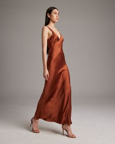 The bias-cut sandwashed silk Double V Slip Dress elegantly drapes on the body. This perfect basic can be worn both casually and formally, making it ideal for any occasion. Pair with one of our shawls, boleros, or dusters for an effortless ensemble. 100% Sandwashed Silk Made in New York City Product Care: Dry Clean Only Bias Slip Dress, Dress Elegantly, Easy Go, Dark Autumn, Silk Outfit, Scarf Top, Rust Dress, Dusters, Caftan Dress