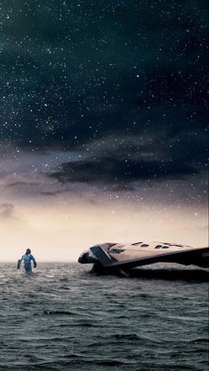 an image of a space shuttle floating in the ocean with two people standing on it