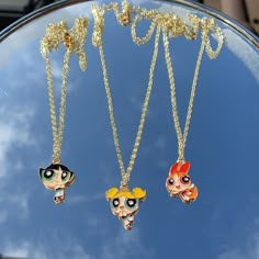 a golden plated necklace chain with a powerpuff girl pendant!  * select your powerpuff girl: * bubbles 🫧  * blossom 🌸 * buttercup ☘️ * necklace length = 18.5 inches to keep good care of your jewellery: * avoid leaving in direct sunlight  * remove before showering or exercising * if wet, dry with towel  * any issues with your purchase, please contact me for a refund or replacement  Check out my Instagram @sophsearringshop ♥️ Preppy Accessories, Power Puff Girls, Powerpuff Girls Wallpaper, Trio Necklace, Barbie Bridal, Powerpuff Girl, Power Puff, Bff Necklaces, Hand Necklace