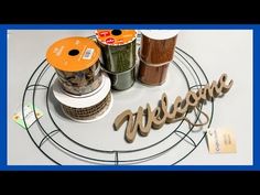 there is a sign that says welcome on the table next to some spices and seasonings