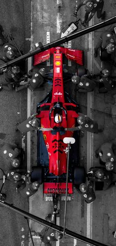 a red race car is seen from above