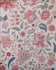 an embroidered fabric with flowers and leaves in pink, blue, red and green colors