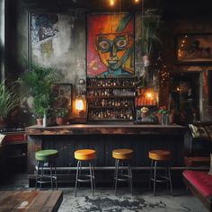 a bar with three stools in front of it and an art work on the wall