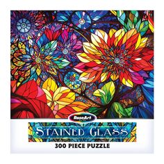 the stained glass 300 piece puzzle is in front of a white background with colorful flowers