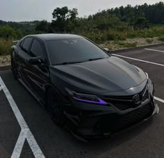 a black car parked in a parking lot