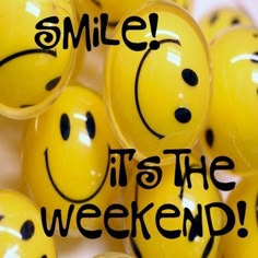 yellow smiley face balls with the words smile it's the weekend