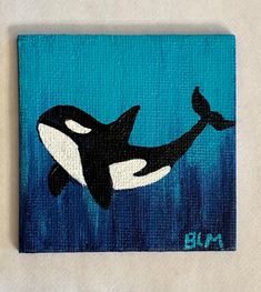 an orca whale painted on a blue background