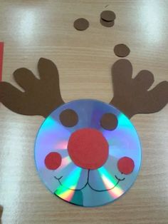 a cd that has been cut out to look like a reindeer's nose and nose