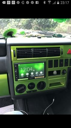 the interior of a car with an electronic display on it's dash board and radio