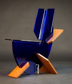 a blue chair sitting on top of a wooden table