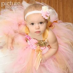 *Please check turn around times. All items are made to order* This listing is for a pink and gold tutu dress that is simply stunning. Made with pink, gold, and ivory tulle. Bodice is adorned with multiple styles of different colored flowers to match. Comes with gold satin straps that criss crosses in the back to form a bow. Headband is not included but can be purchased separately. I will need 3 measurements. 1. length - measure from waist to knees (or desired length if you would like it longer). Gold Flower Girl Dress, Gold Tutu Dress, Pink And Gold 1st Birthday, Tutu Dress Pink, Pink And Gold First Birthday, Gold Flower Girl, High Chair Tutu, Carousel Birthday, First Birthday Dress