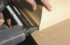 a person using a tool to cut wood